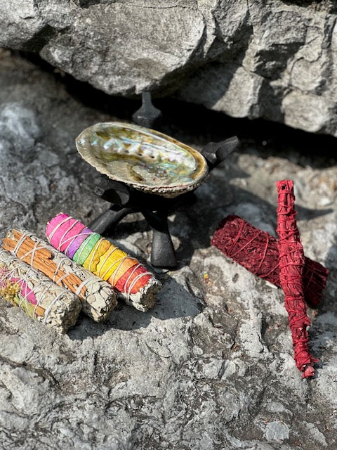 5 pieces of sage located on top of a stone stucture